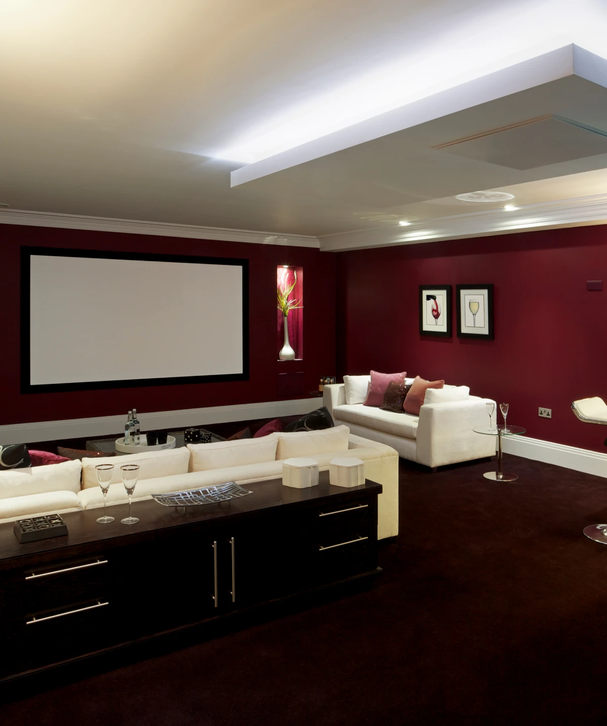 Home theater with white sofas