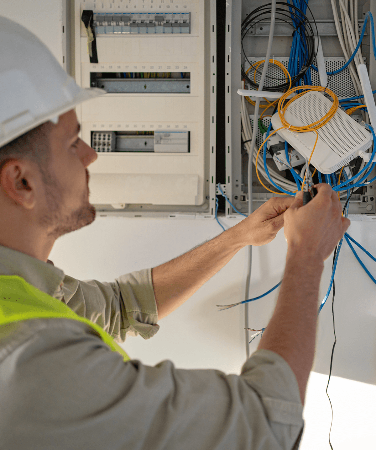 Technician fixing electrical wiring